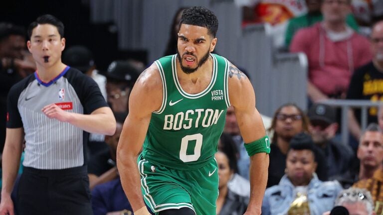 Jayson Tatum #0 of the Boston Celtics reacts after dunking against the Atlanta Hawks during the fourth quarter at State Farm Arena on March 25, 2024 in Atlanta, Georgia.