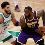 Boston Celtics' Jayson Tatum (0) defends against Los Angeles Lakers' LeBron James (23) during the second half of an NBA basketball game Saturday, Jan. 30, 2021, in Boston.