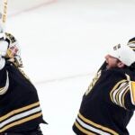 Boston Bruins' Linus Ullmark, left, and Jeremy Swayman celebrate after defeating the Pittsburgh Penguins during an NHL hockey game, Saturday, March 9, 2024, in Boston