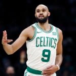 Celtics' Derrick White reacts after making a 3-pointer during the first half.