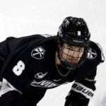 Providence forward Riley Duran (8) skates during the second period of an NCAA hockey game against Northeastern on Saturday, Nov. 11, 2023, in Boston.