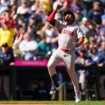 The Red Sox's Enmanuel Valdez celebrates while jogging the bases after hitting a three-run home run against the Seattle Mariners during the fourth inning.