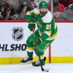 Minnesota Wild left wing Pat Maroon (20) skates with the puck during the second period of an NHL hockey game against the Detroit Red Wings Thursday, Dec. 27, 2023, in St. Paul, Minn.