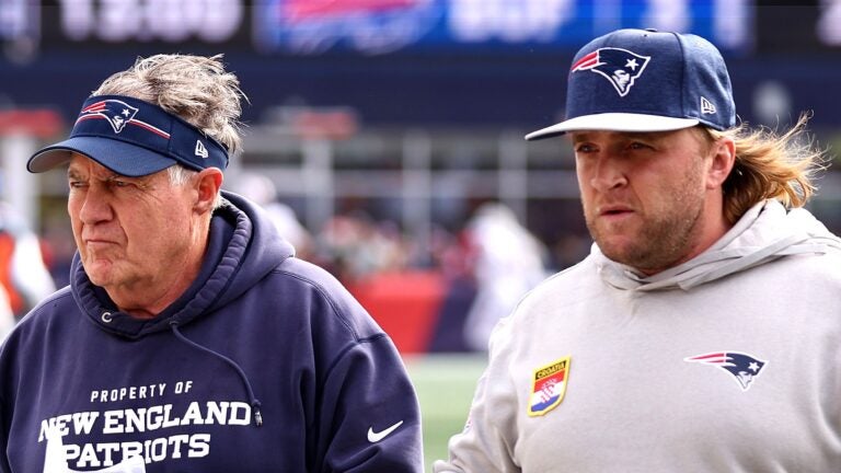FOXBOROUGH, MASSACHUSETTS - OCTOBER 22: : Head coach Bill Belichick of the New England Patriots and linebackers coach Steve Belichick walk together during the game against the Buffalo Bills at Gillette Stadium on October 22, 2023 in Foxborough, Massachusetts.