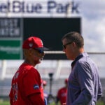 Boston Red Sox manager Alex Cora and Sam Kennedy, Red Sox President and CEO chat during Boston Red Sox Spring Training.