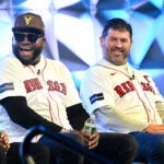 Pedro Martinez, left, David Ortiz and Jason Varitek share a laugh during a panel discussion on the 20th anniversary of the 2004 World Series championship team during the Red Sox Winter Weekend at MassMutual Center in Springfield.