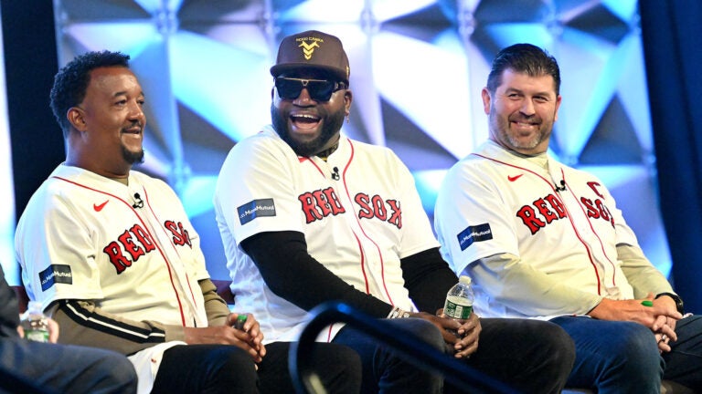 Pedro Martinez, left, David Ortiz and Jason Varitek share a laugh during a panel discussion on the 20th anniversary of the 2004 World Series championship team during the Red Sox Winter Weekend at MassMutual Center in Springfield.