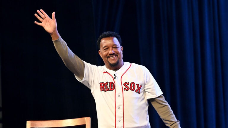 Former Red Sox pitcher Pedro Martinez makes his entrance for a panel discussion on the 2004 World Series championship during the Red Sox Winter Weekend at MassMutual Center in Springfield.