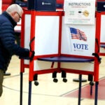 A voter make's his choices during Super Tuesday primary election voting at the Bridgewater Middle School.