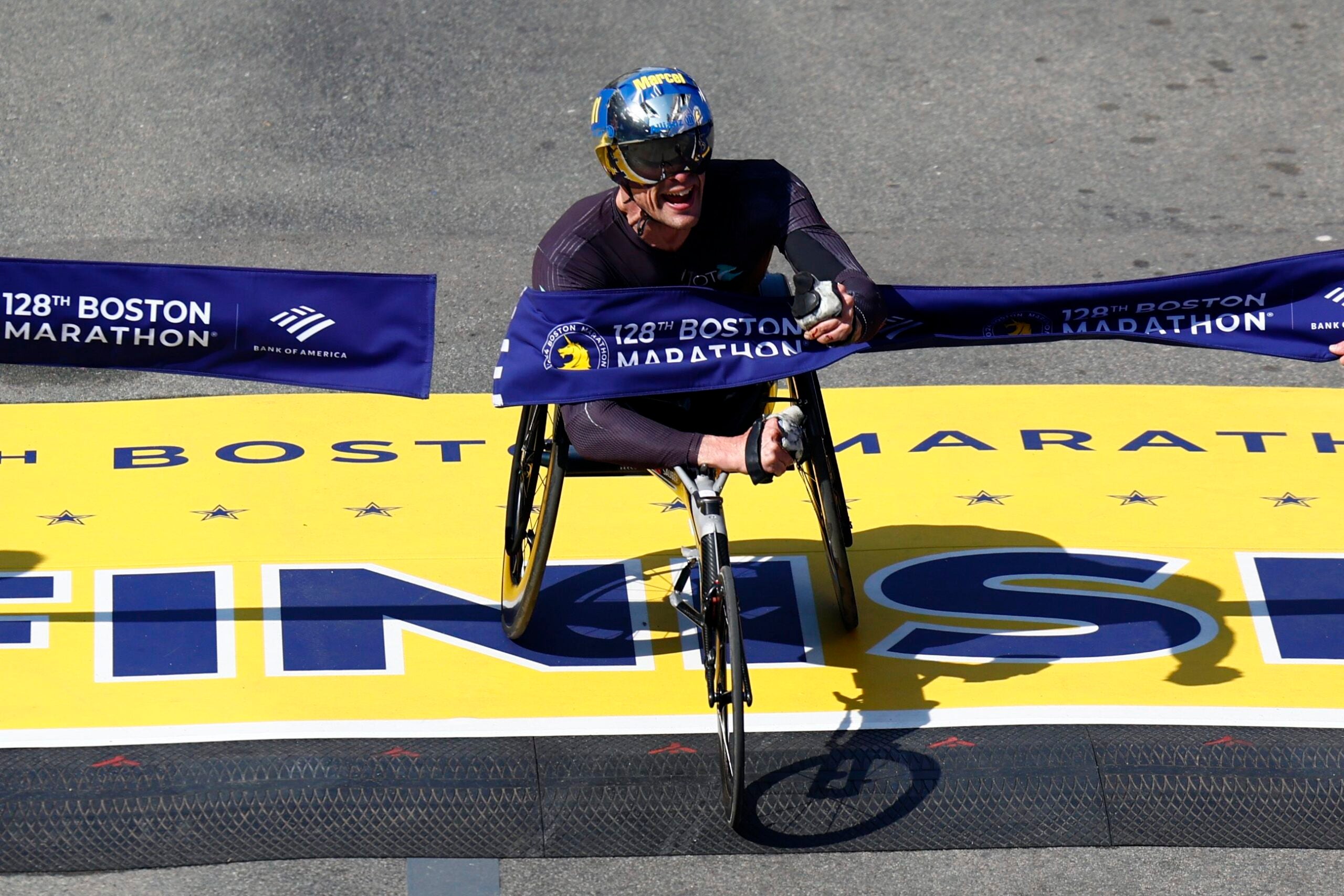Marcel Hug of Switzerland finishes first with a time of 1:15:33 in men’s wheelchair during the Boston Marathon on Monday, April 15, 2024.
