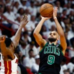 Celtics guard Derrick White takes a shot over Miami Heat forward Haywood Highsmith during the first quarter.
