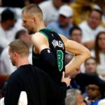 Miami, FL- 4/29/24- Boston Celtics center Kristaps Porzingis (8) walks off the court with an apparent injury during the second quarter in game four of the NBA Eastern Conference Playoffs.