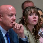 Hannah Gutierrez-Reed, center, sits with her attorney Jason Bowles and paralegal Carmella Sisneros during her sentencing hearing in Santa Fe, New Mexico.