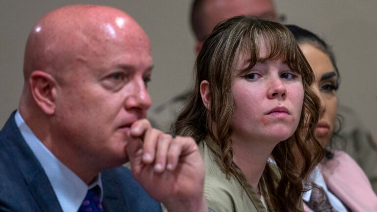 Hannah Gutierrez-Reed, center, sits with her attorney Jason Bowles and paralegal Carmella Sisneros during her sentencing hearing in Santa Fe, New Mexico.