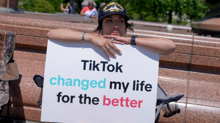 A TikTok content creator, sits outside the U.S. Capitol.