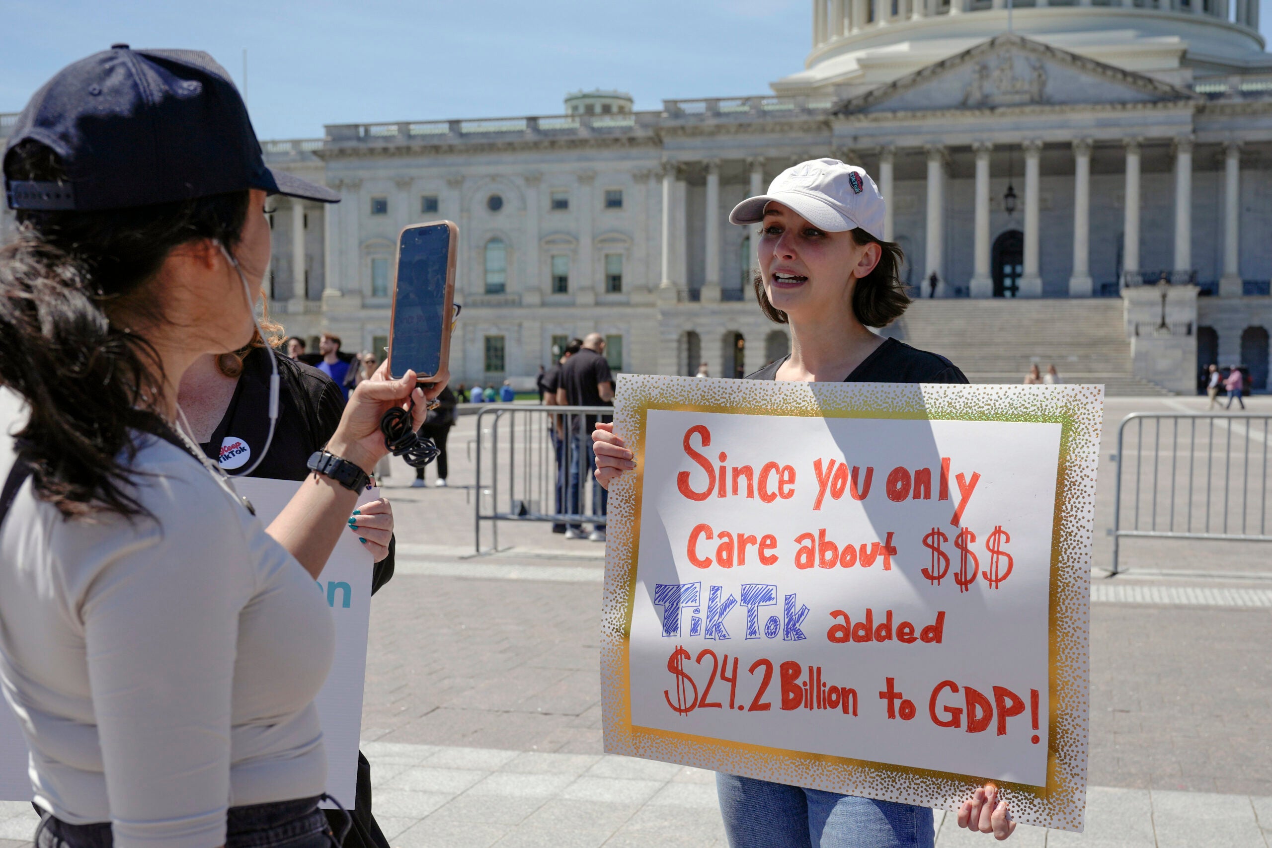 A TikTok content creator, speaks to reporters outside the U.S. Capitol.