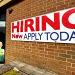 A hiring sign is displayed in Riverwoods, Ill.