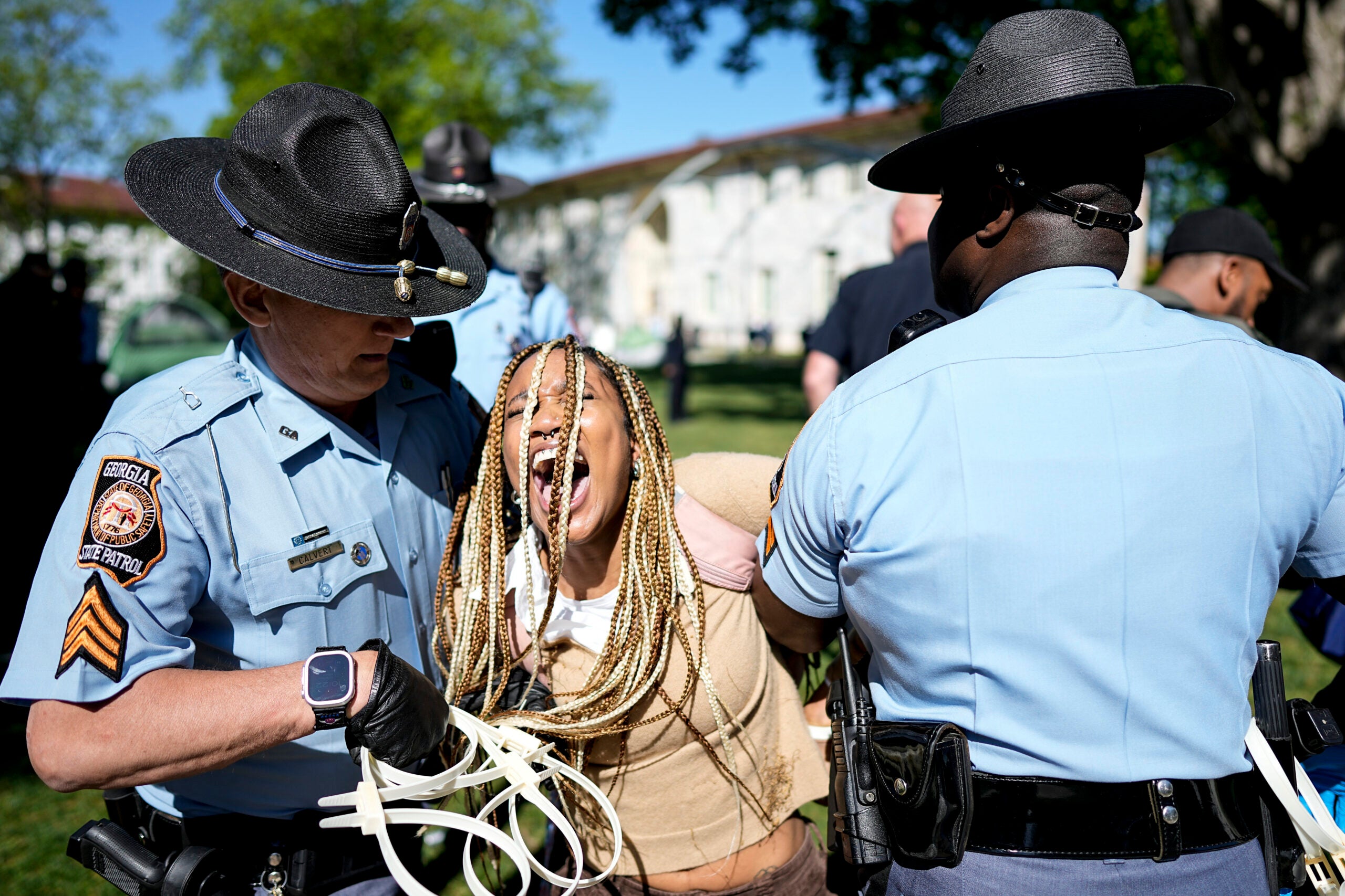 Georgia State Patrol officers arrest a protester on the Emory University campus.