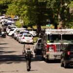 Multiple law enforcement vehicles respond in the neighborhood.