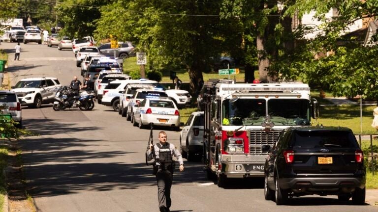 Multiple law enforcement vehicles respond in the neighborhood.