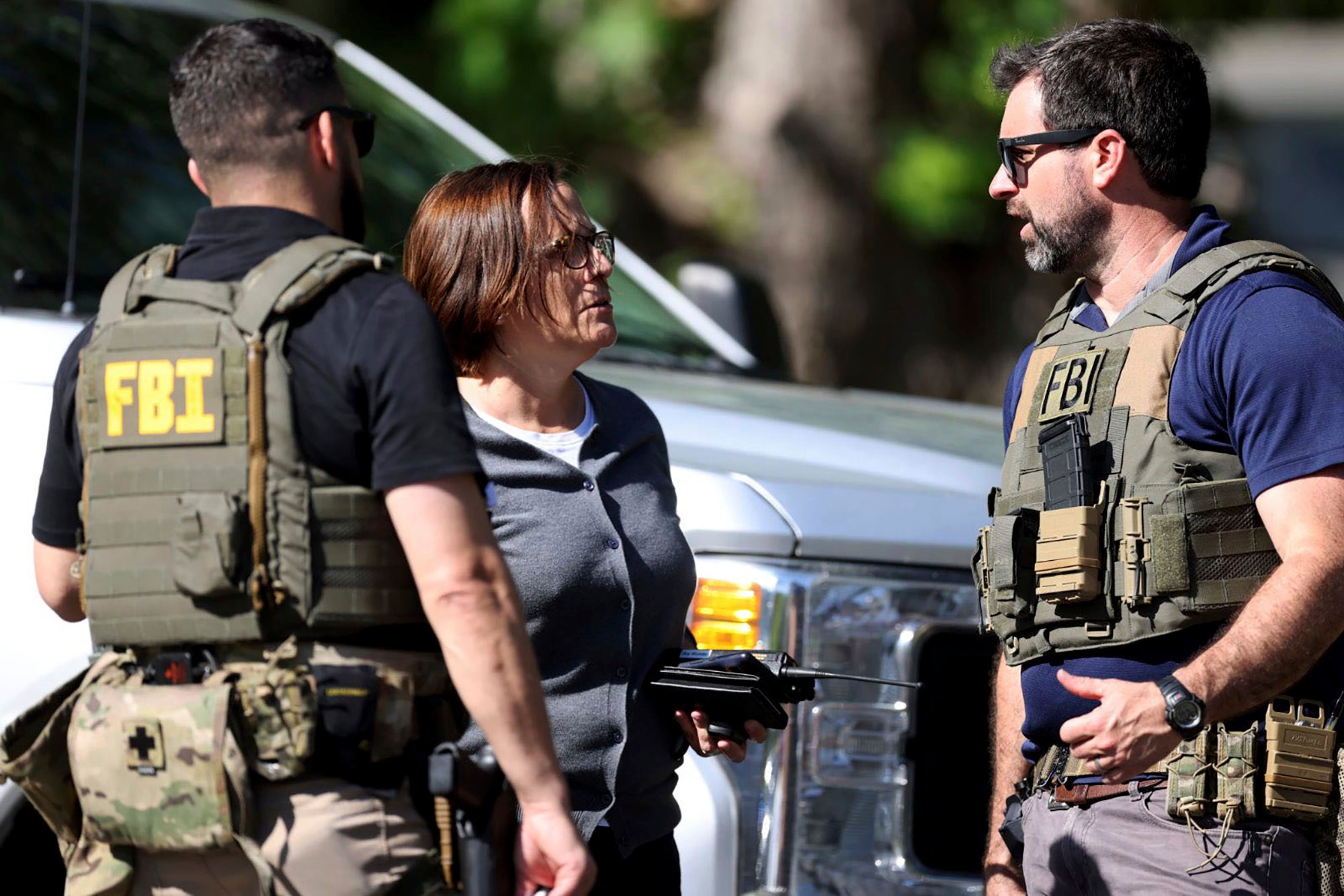 Members of FBI talk with each other at the scene of a shooting on Galway Drive in Charlotte, N.C. 