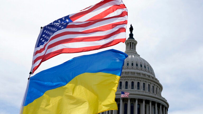 The American and Ukrainian flags wave in the wind outside of the Capitol on Tuesday, April 23, 2024, in Washington.