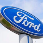 FILE - A Ford sign is shown at a dealership in Springfield, Pa., Tuesday, April 26, 2022. Ford is recalling nearly 43,000 small SUVs, Wednesday, April 10, 2024, because gasoline can leak from the fuel injectors onto hot engine surfaces, increasing the risk of fires. But the recall remedy does not include repairing the fuel leaks.