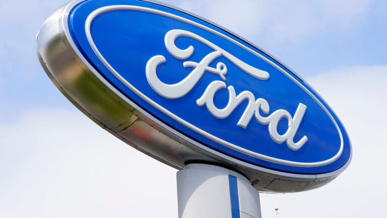 FILE - A Ford sign is shown at a dealership in Springfield, Pa., Tuesday, April 26, 2022. Ford is recalling nearly 43,000 small SUVs, Wednesday, April 10, 2024, because gasoline can leak from the fuel injectors onto hot engine surfaces, increasing the risk of fires. But the recall remedy does not include repairing the fuel leaks.