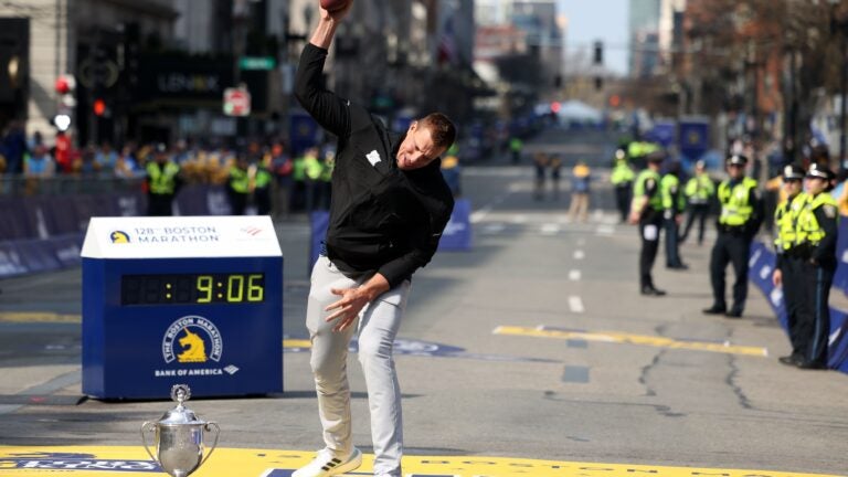 Grand marshal Rob Gronkowski spiked a football at the finish line and the party was on for the Boston Marathon.