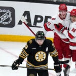 Hurricanes left wing Teuvo Teravainen (86) is congratulated by Andrei Svechnikov (37) after his goal during the second period against the Bruins.