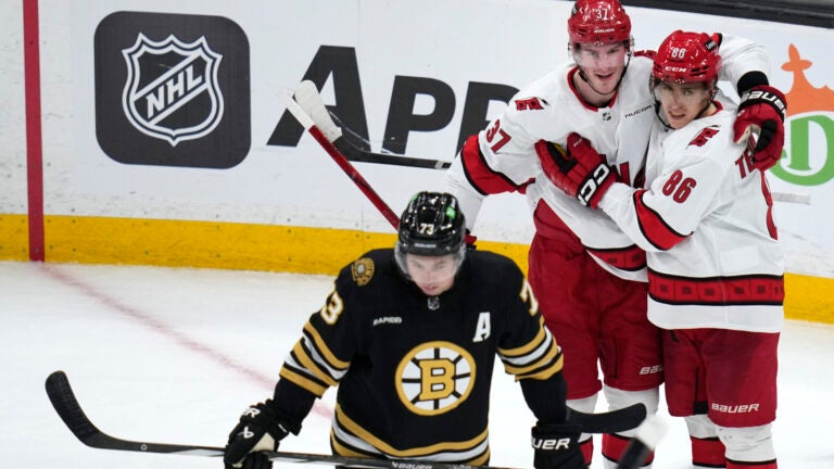 Hurricanes left wing Teuvo Teravainen (86) is congratulated by Andrei Svechnikov (37) after his goal during the second period against the Bruins.
