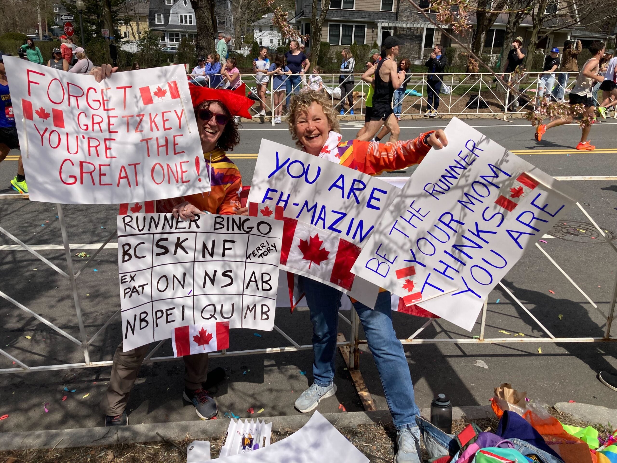 The best signs spotted along the 128th Boston Marathon route