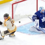 Bruins center Trent Frederic scores during a March 7 game against the Toronto Maple Leafs.