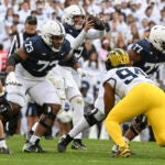 Penn State offensive lineman Caedan Wallace (73) looks to block Michigan defensive lineman Kris Jenkins (94) during the first half of an NCAA college football game, Saturday, Nov.11, 2023, in State College, Pa.