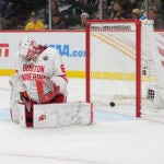Boston University goaltender Mathieu Caron was unable to stop Tristan Broz's shot in overtime that delivered a 2-1 victory for Denver in the NCAA men's hockey national semifinals.