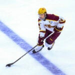 Minnesota's Jaxon Nelson (24) advances the puck up the ice against Omaha during the third period of an NCAA men's college hockey tournament regional game Thursday, March 28, 2024, in Sioux Falls, S.D.