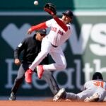 Baltimore Orioles' Cedric Mullins steals second base as the Red Sox's David Hamilton gets the late throw during the second inning.