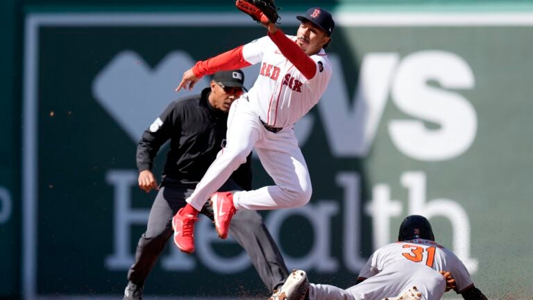 Baltimore Orioles' Cedric Mullins steals second base as the Red Sox's David Hamilton gets the late throw during the second inning.
