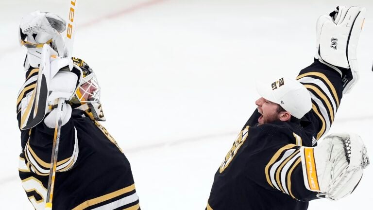 Boston Bruins' Linus Ullmark, left, and Jeremy Swayman celebrate after defeating the Pittsburgh Penguins during an NHL hockey game, Saturday, March 9, 2024, in Boston.