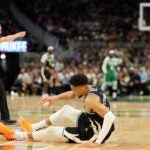 Giannis Antetokounmpo of the Bucks is injured during the second half of the game against the Celtics.