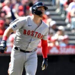Red Sox Reese McGuire watches his three-run home run against the Los Angeles Angels during the sixth inning.