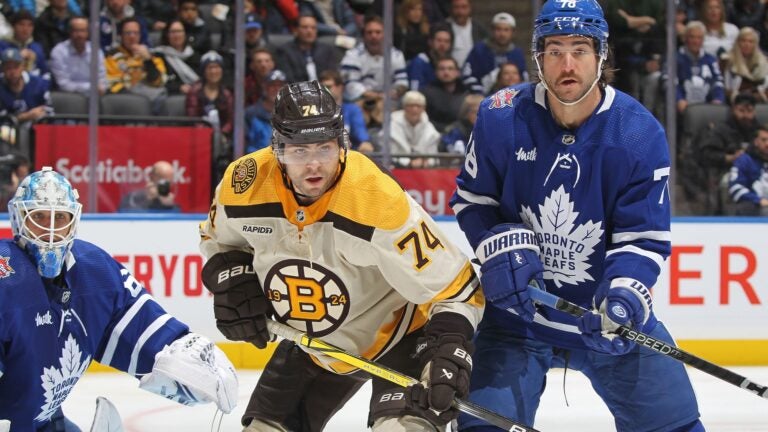 TORONTO, CANADA - DECEMBER 2: Jake DeBrusk #74 of the Boston Bruins battles against T.J. Brodie #78 of the Toronto Maple Leafs during the third period in an NHL game at Scotiabank Arena on December 2, 2023 in Toronto, Ontario, Canada. The Bruins defeated the Maple Leafs 4-3 in overtime.
