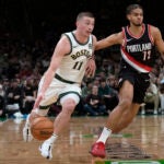 Celtics guard Payton Pritchard drives to the basket against Portland Trail Blazers guard Rayan Rupert during the first half.