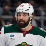 Minnesota Wild left wing Pat Maroon (20) smiles as he skates on the ice waiting for a face off against the Seattle Kraken during the third period of an NHL hockey game, Sunday, Dec. 10, 2023, in Seattle. The Wild won 3-0.