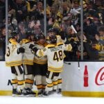 BOSTON, MASSACHUSETTS - JANUARY 20: Charlie Coyle #13 of the Boston Bruins celebrates with Matt Grzelcyk #48, Charlie McAvoy #73, Brad Marchand #63 and David Pastrnak #88 after scoring against the Montreal Canadiens during the second period at TD Garden on January 20, 2024 in Boston, Massachusetts.