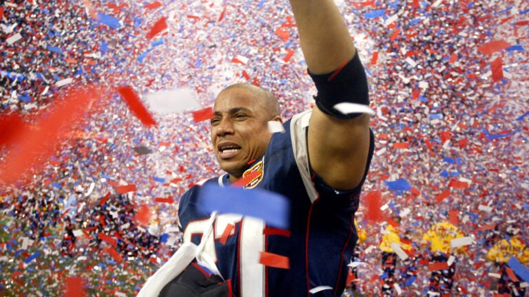 Patriots safety Rodney Harrison, who injured his arm in the victory, is in tears as the confetti swarms around him after the Patriots victory.