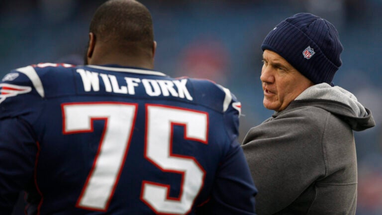 Patriots head coach Bill Belichick talks to nose tackle Vince Wilfork during pre- game action at Gillette Stadium on Sunday December 13, 2009.