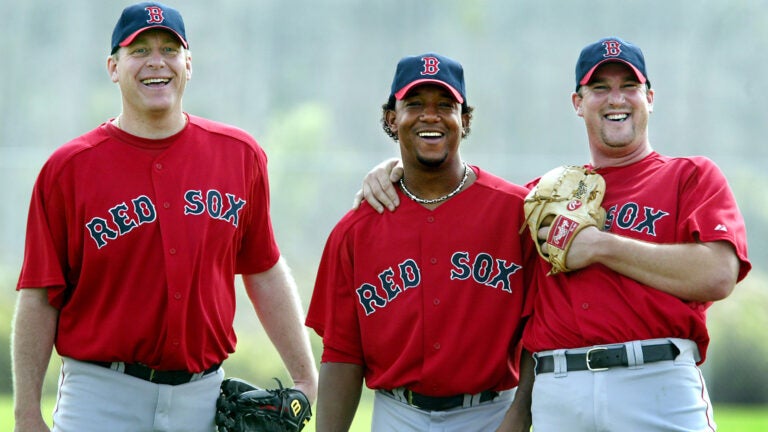 The Red Sox are expected to have one of the most feared top three starting pitchers at the top of their rotation in all of baseball this season. Curt Schilling, (left), and Derek Lowe (right) have been in camp for some time, but they were happy to see the third member of the troika, Pedro Martinez (center) arrive for his first workout this morning.