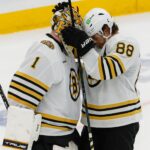 Boston Bruins right wing David Pastrnak (88) talking to goalie Jeremy Swayman (1) after they defeated the Toronto Maple Leafs 3-1 in game four of the Eastern Conference NHL Playoffs at Scotiabank Arena.