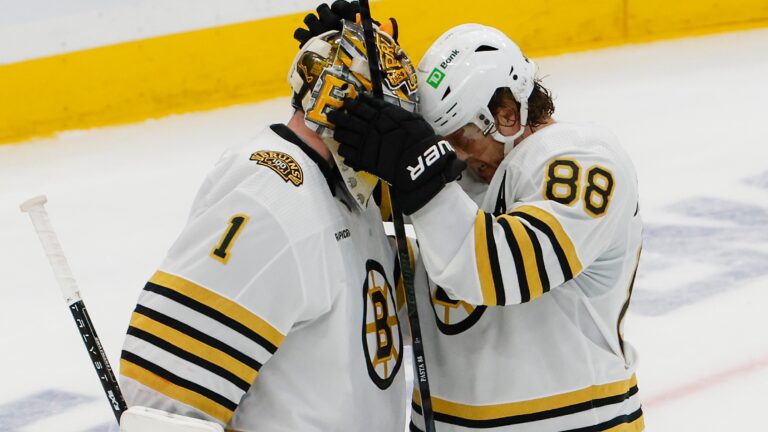 Boston Bruins right wing David Pastrnak (88) talking to goalie Jeremy Swayman (1) after they defeated the Toronto Maple Leafs 3-1 in game four of the Eastern Conference NHL Playoffs at Scotiabank Arena.